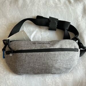 Therabody waist belt travel bag with accessories inside